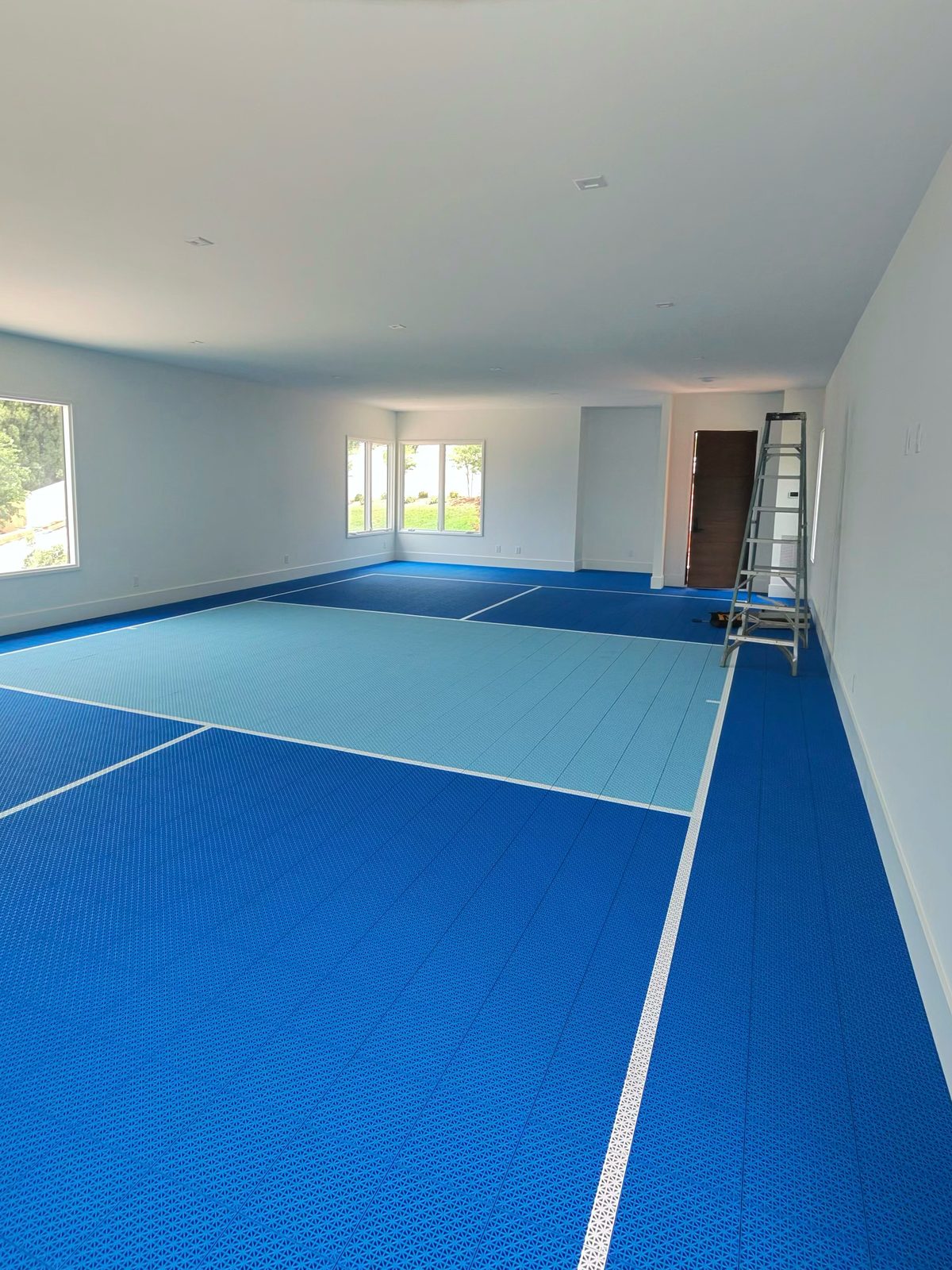 Custom indoor pickleball court installed in a home