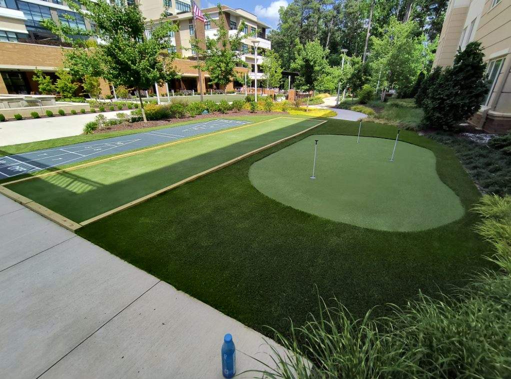 Backyard putting green with stone surround Southeast Recreational