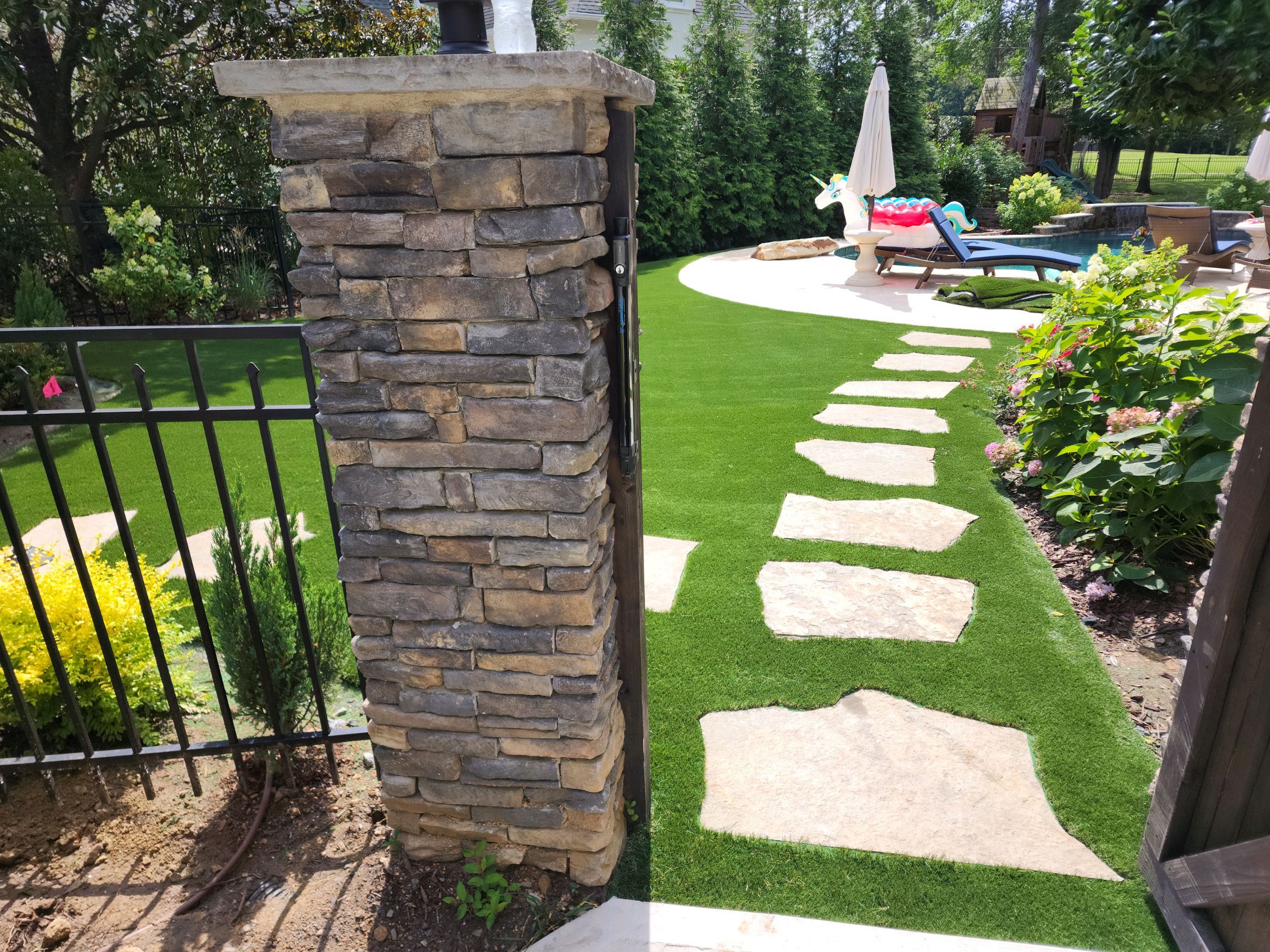 Synthetic turf and pavers pool surround Southeast Recreational
